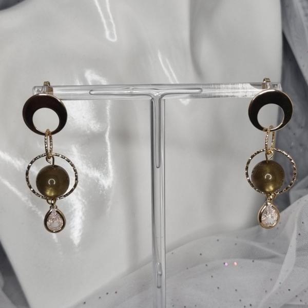 Speelse vergulde oorbellen met zirkonia en polaris - groen