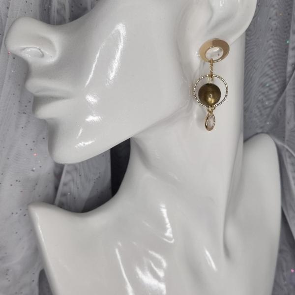 Speelse vergulde oorbellen met zirkonia en polaris - groen