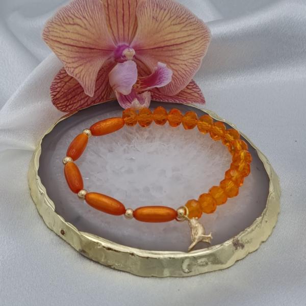 Handgemaakte armband met vergulde bedel - oranje