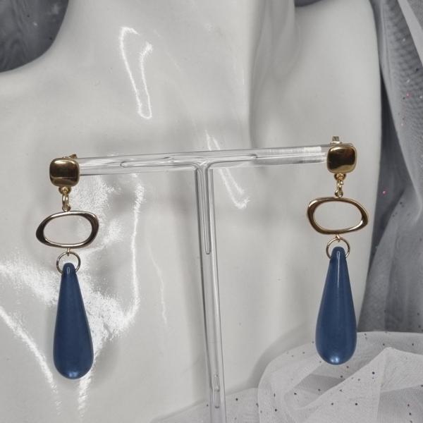 Vergulde statement oorbellen met polaris - blauw